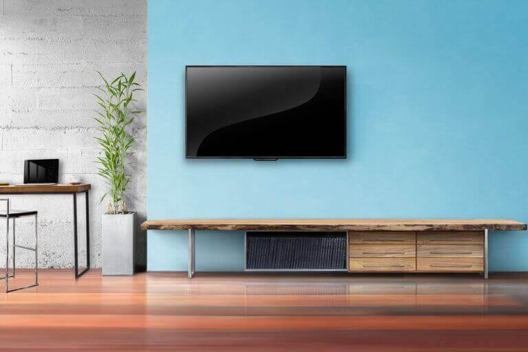 Muur met meubel en televisie